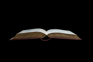 Very old book on black background