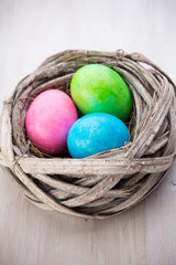 Obraz na płótnie Canvas Easter eggs in the nest. Spring discount card.