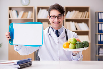 Doctor in dieting concept with fruits and vegetables