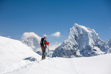 Naklejka na ściany i meble Trekker is walking by Renjo La pass in Everest region