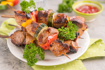 Grilled pork kebab with red and yellow pepper