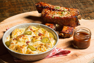 Spare ribs with barbecue sauce and potato salad