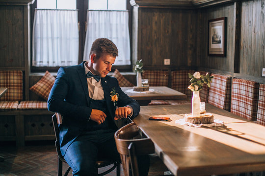 Handsome Groom Sitting In The Bar And Waiting His Bride