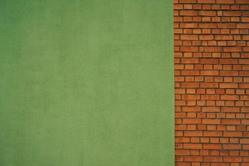 Connected light green painted wall and brick wall for background or texture