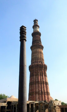 The Qutub Minar minaret and the iron pillar in New Delhi, India.