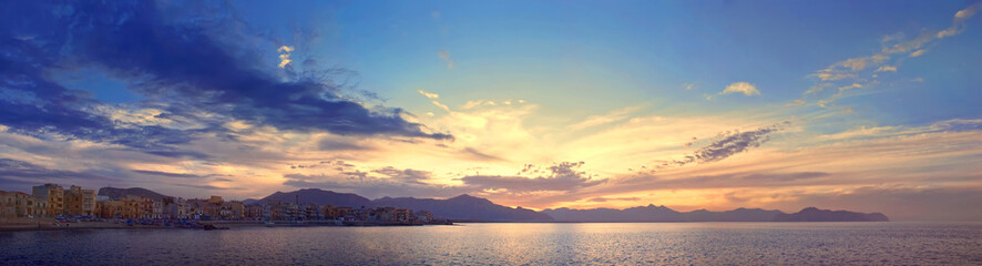 Fototapeta na wymiar Colorful panoramic view of Sicily coastline with cloudy sunset sky, Mediterranean sea