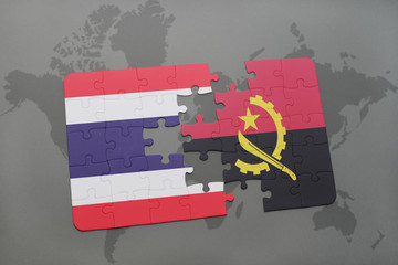 puzzle with the national flag of thailand and angola on a world map