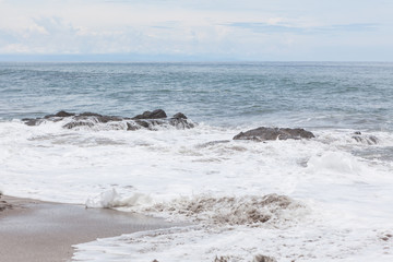 Waves crashing to rocks montezuma beach