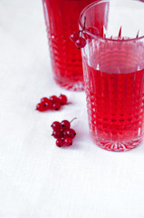 Drink red currant in a beautiful transparent glass