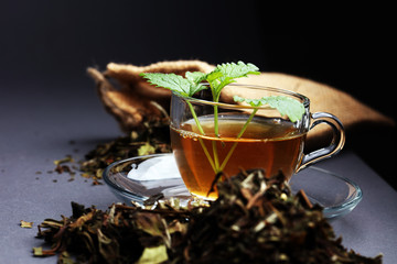 Herbal dry sri lanka tea. Mint leaf. Tea in a glass cup, mint leaves, dried tea, in a restaurant or teahouse