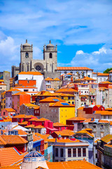 View over the old town of Porto, Portugal with the cathedral, colorful buildings and orange roofs - obrazy, fototapety, plakaty
