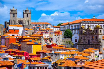 Naklejka premium View over the old town of Porto, Portugal with the cathedral, the church of St. Lawrence and colorful buildings