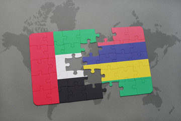 puzzle with the national flag of united arab emirates and mauritius on a world map