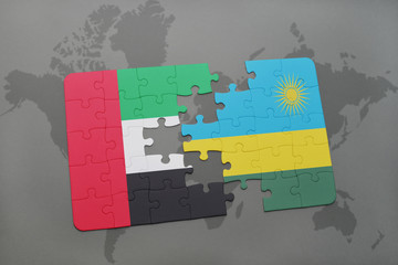 puzzle with the national flag of united arab emirates and rwanda on a world map