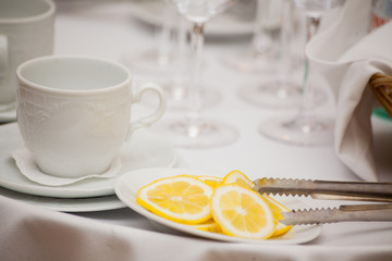 Cup of tea with lemon on table close-up.