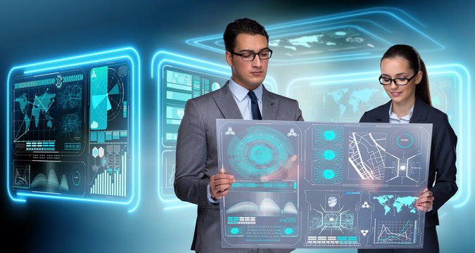 Pair of businessman and businesswoman discussing data