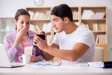 Young family discussing family finances