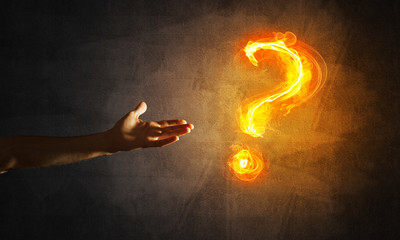 Concept of help or support with fire burning question mark and creation gesture