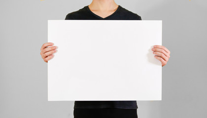 Man showing blank white big A2 paper. Leaflet presentation. Pamphlet hold hands. Man show clear...