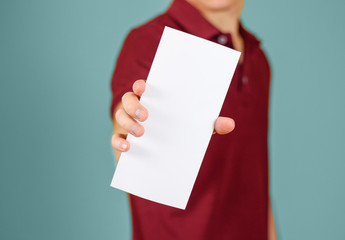 Man showing blank white flyer brochure booklet. Leaflet presentation. Pamphlet hold hands. Man show clear offset paper. Sheet template. Booklet design sheet display read first person