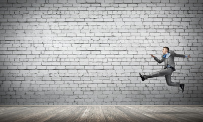 Businessman jumping high