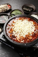 Grilled Small Octopus on a Hot Plate with beef