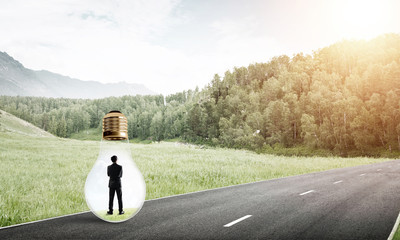 Businessman inside light bulb