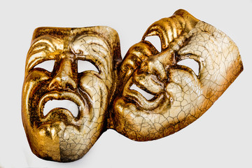 Two theatrical mask sadness and joy photographed on white background