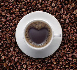 Black coffee cup of Love with Heart shape on coffee bean