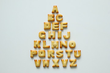 An English alphabet from the cookies on the white background.