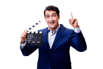 Handsome man with movie clapper isolated on white