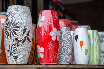 A composition of artistic painted handcrafted pottery
