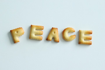An inscription from the cookies on the white background. Text – peace.