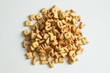 The numbers and letters from cookies close up on the white background.