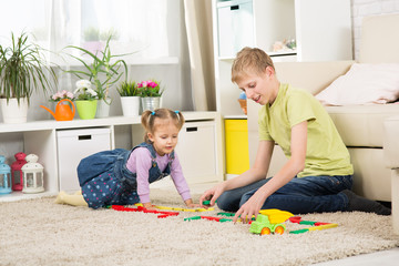 Brother and sister are playing