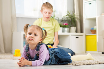 Brother and sister are playing