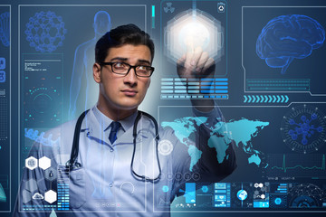 Doctor in futuristic medical concept pressing button