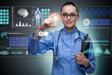 Doctor in futuristic medical concept pressing button