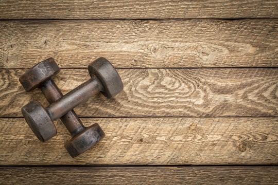 dumbbells on wood - exrecise concept
