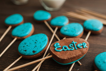 Easter blue cake pops on the wood rustic table for easter celebration, closeup. Holiday sweets concept