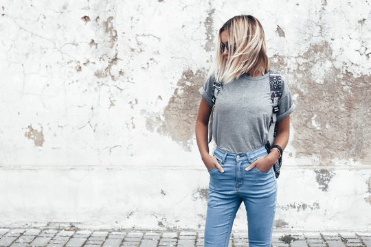 Model Posing In Plain Tshirt Against Street Wall