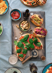 Pizza, different hot dogs, beer and snack for beer