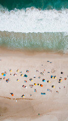 Fototapeta na wymiar Beach shore umbrellas from above