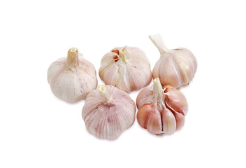 Several garlic bulbs on a light background