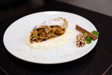A piece of apetite strudel on a white plate