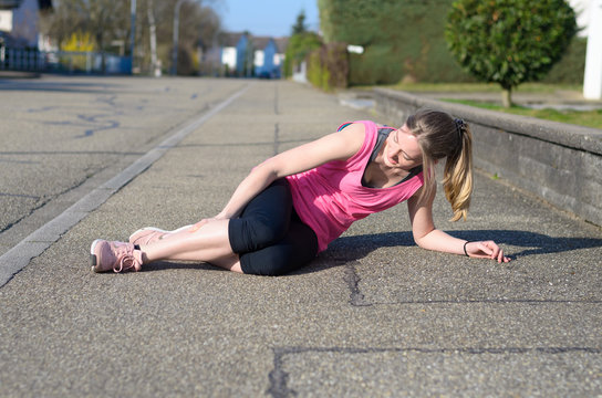 Female Athlete With Calf Cramps