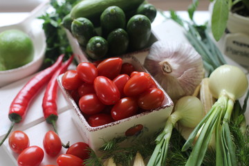 fresh vegetables and herbs, oregano, sage, chive, parsley, dill, onion, cucumber, green vegetables,  red vegetables, red pepper, pepper, garlic, cucumber, sweet corn, 