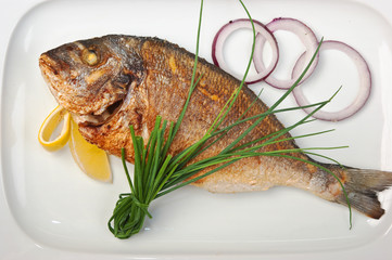 dish of fried fish with onions