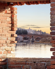 historical quarter of Verona, view on ponte Pietra bridge at sunset