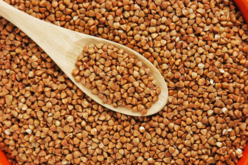 buckwheat groats and wooden spoon